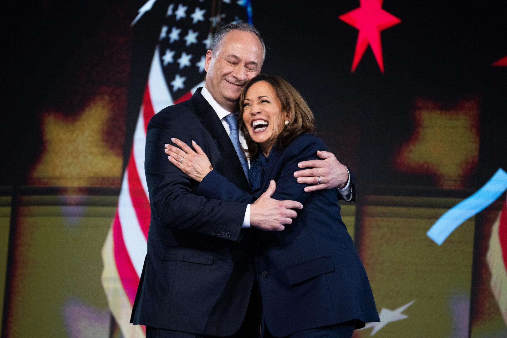 Vice President Kamala Harris, Democratic presidential nominee, and second gentleman Doug Emhoff celebrate on the final night of the Democratic National Convention at the United Center in Chicago on Thursday.