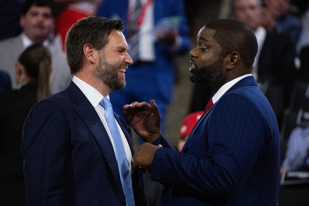 Rep. Byron Donalds, R-Fla., right, and Sen. JD Vance of Ohio, the GOP vice presidential nominee, talk at the Fiserv Forum on July 15 during the Republican National Convention.