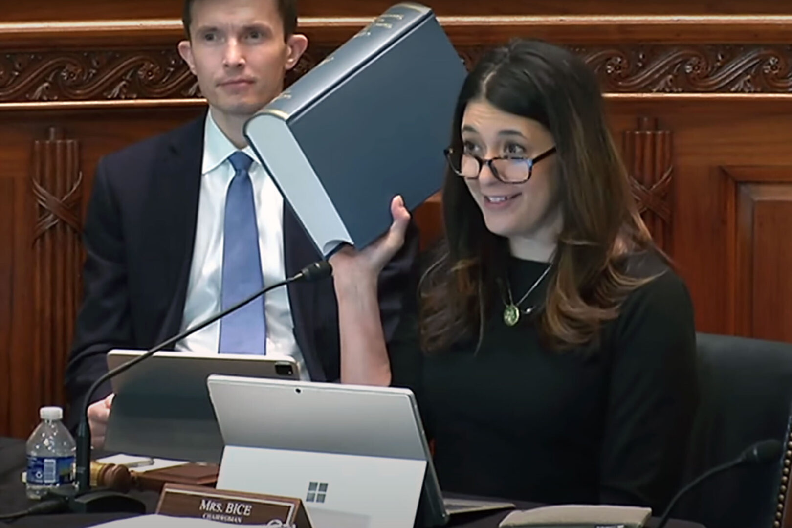 Rep. Stephanie Bice holds up the printed Constitution Annotated, which would be eliminated under her proposed legislation in favor of the online version.