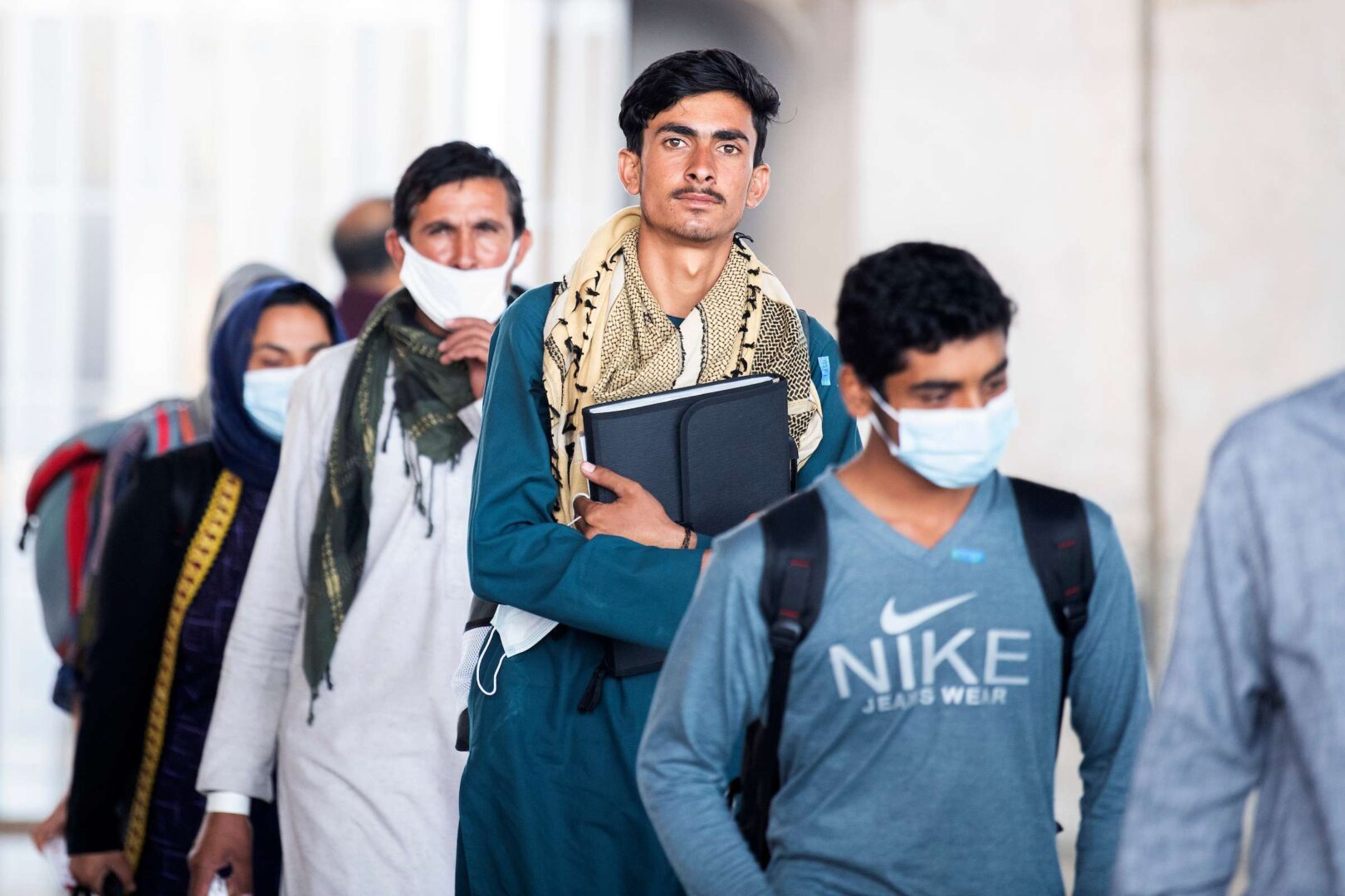 Afghan refugees arrive at Dulles International Airport on Aug. 27. 