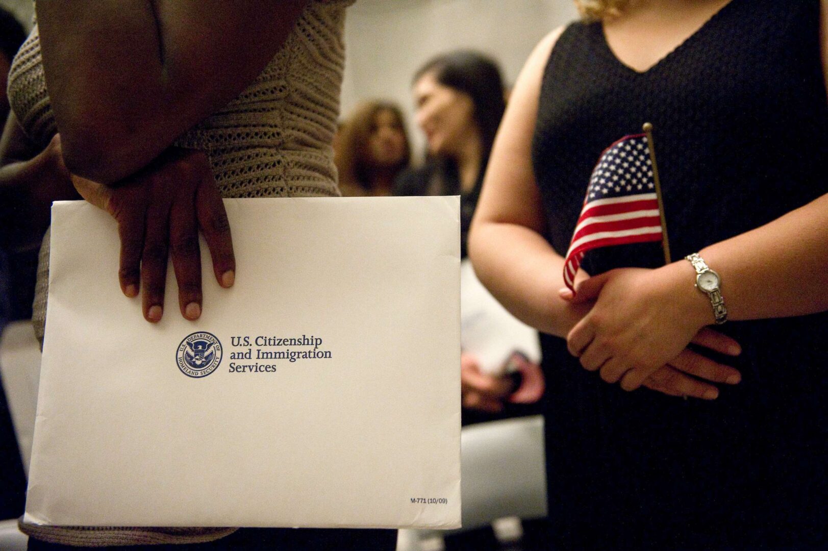 Petitioners await at a naturalization ceremony  at the National Archives. 