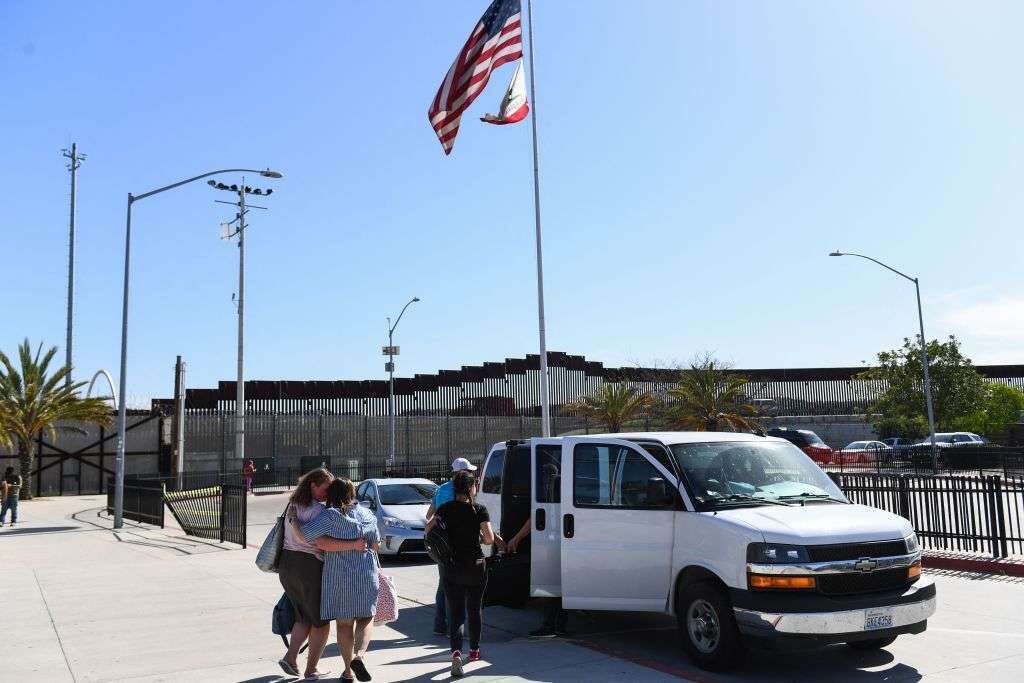 Refugees from Ukraine enter a van after crossing the San Ysidro PedWest port of entry along the U.S.-Mexico border between Tijuana, Baja California, and the U.S. on April 8, 2022 in San Ysidro, California.