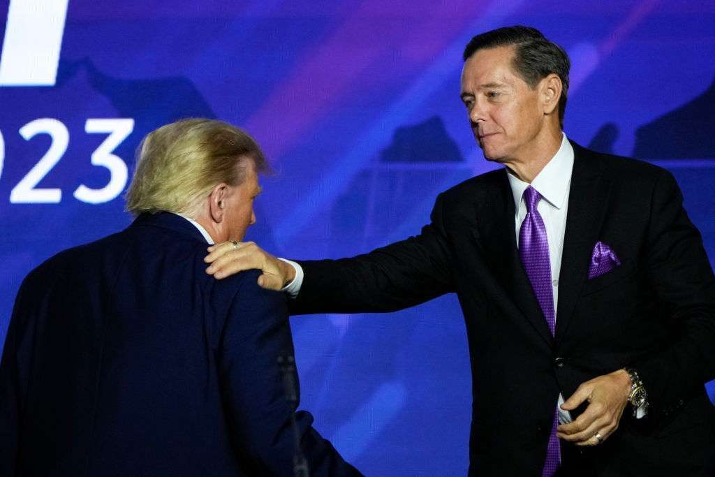 Chairman of the Faith & Freedom Coalition Ralph Reed pats Republican presidential candidate and former President Donald Trump on the shoulder after Trump spoke at the Faith & Freedom Road to Majority conference at the Washington Hilton on Saturday.