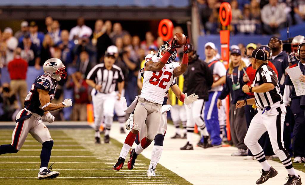 New York Giants receiver Mario Manningham makes a catch for a 39-yard gain against the New England Patriots in the fourth quarter of Super Bowl XLVI on Feb. 5, 2012, in Indianapolis.