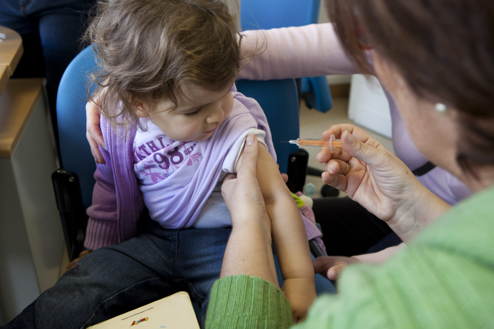 A child receives a flu shot. Community health centers have struggled to regain their financial footing in the aftermath of the Change Healthcare hack. 