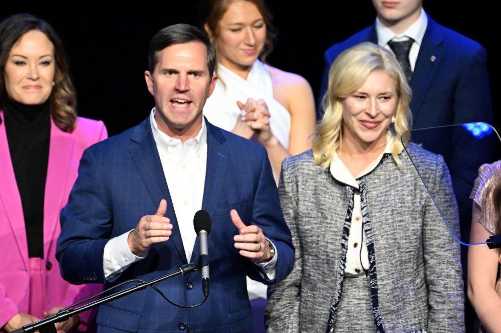 Democratic Gov. Andy Beshear of Kentucky is joined by his wife, Britainy Beshear, as he delivers his victory speech Tuesday in Louisville, Ky.