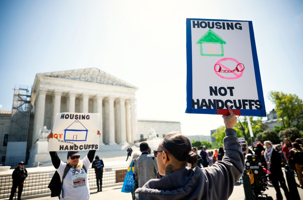 Homeless rights activists rally outside of the Supreme Court on April 22, the day of oral argument in City of Grants Pass, Oregon v. Johnson.