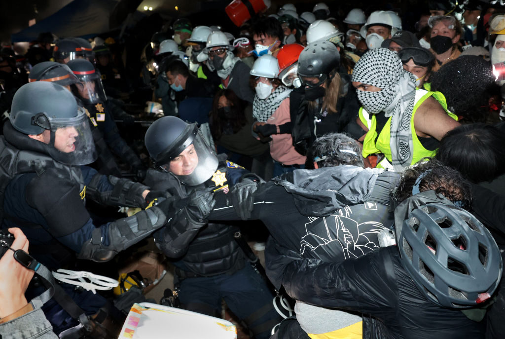 Police clash with protesters after an order to disperse was given at UCLA Thursday morning. 