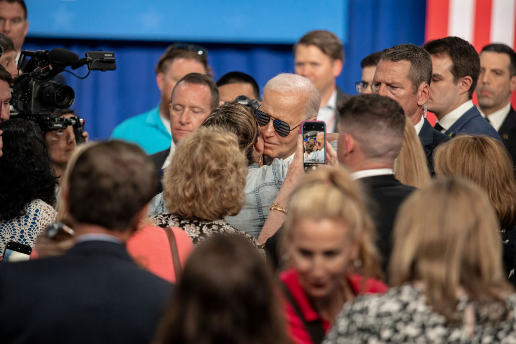 President Joe Biden meets with attendees following remarks about the PACT Act, a law that expanded health care access for veterans with injuries from toxic exposure, at the Westwood Park YMCA in Nashua, N.H., on Tuesday.