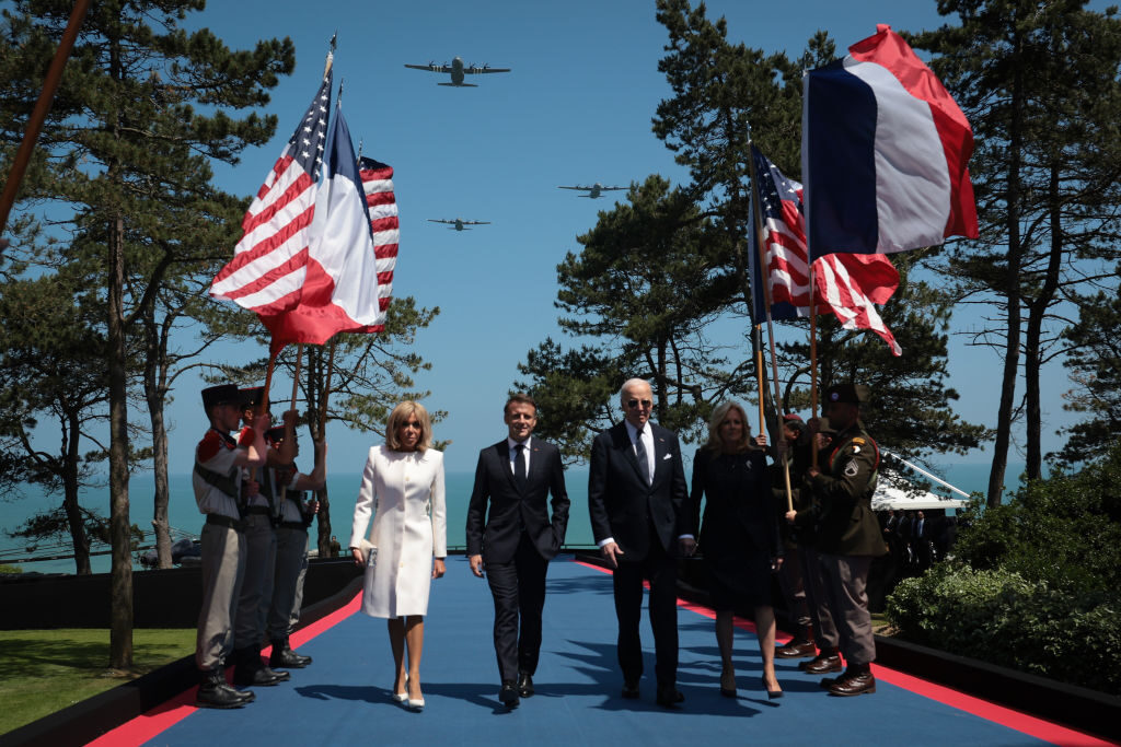 President Joe Biden and first lady Jill Biden walk with French President Emmanuel Macron and his wife, Brigitte Macron, at a ceremony marking the 80th anniversary of D-Day at the Normandy American Cemetery and Memorial on Thursday. 