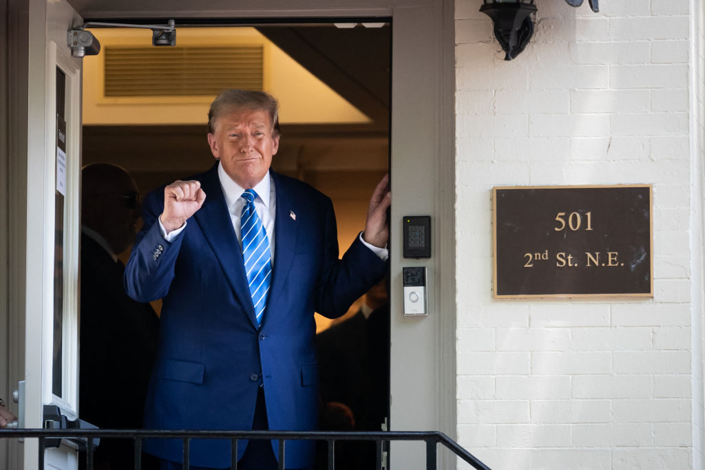 Donald Trump exits a meeting with Senate Republicans hours after a separate session with House Republicans on Capitol Hill on June 14. 