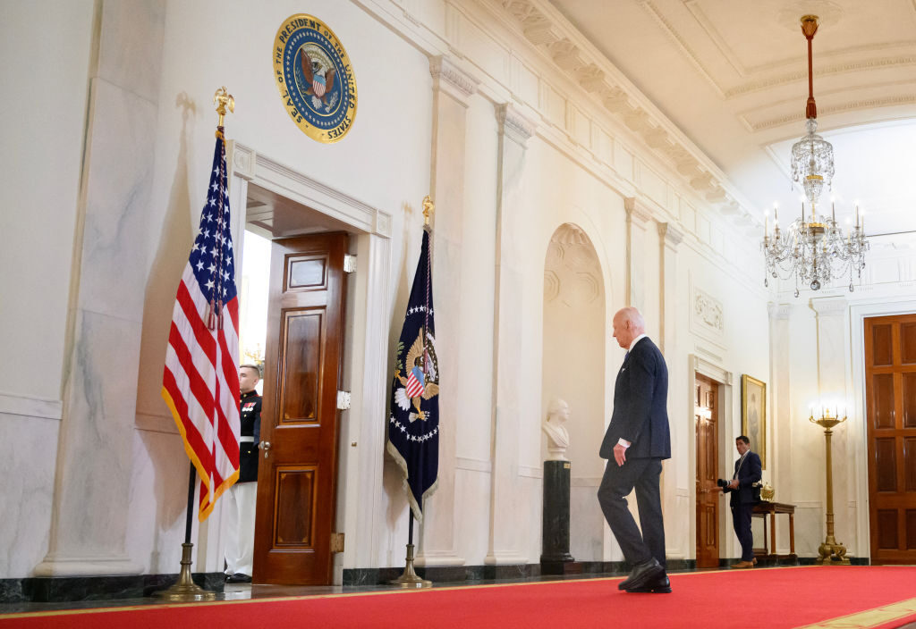 President Joe Biden departs after delivering remarks on the Supreme Court's immunity ruling in the Cross Hall of the White House on Monday night.