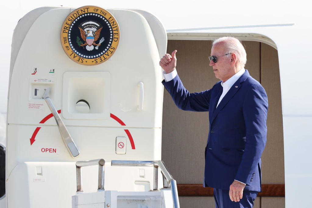 President Joe Biden gives a thumbs-up as leaves Harrisburg International Airport on July 7 after holding several campaign events in Pennsylvania.