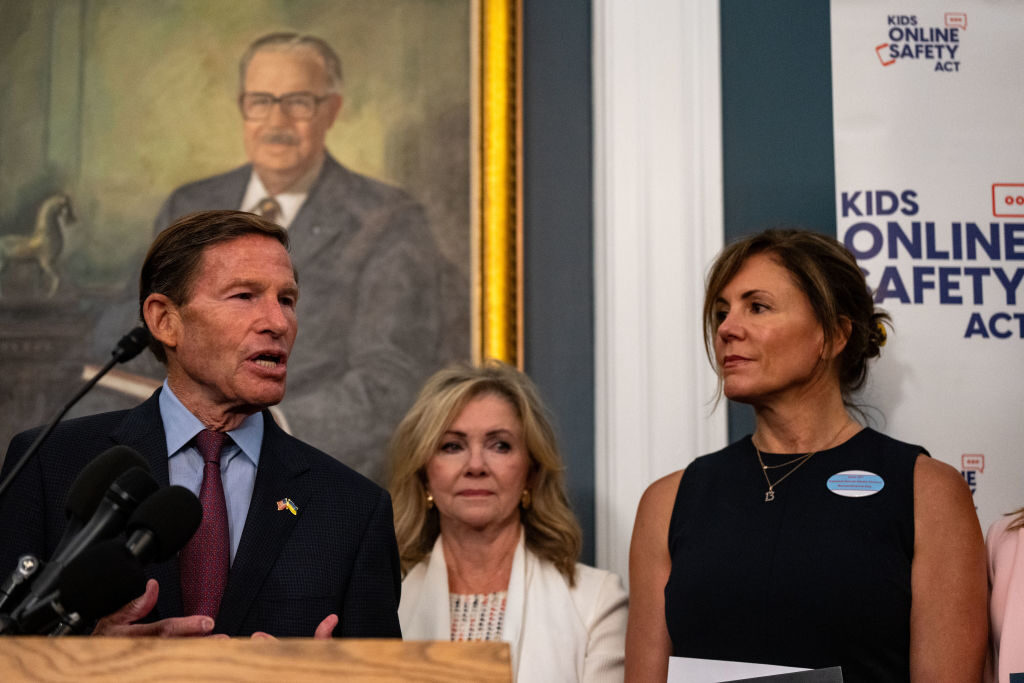 Sens. Richard Blumenthal  and Marsha Blackburn, center, join families of victims of online abuse at a news conference Thursday on the childrens' online safety bill that advanced in the Senate. 