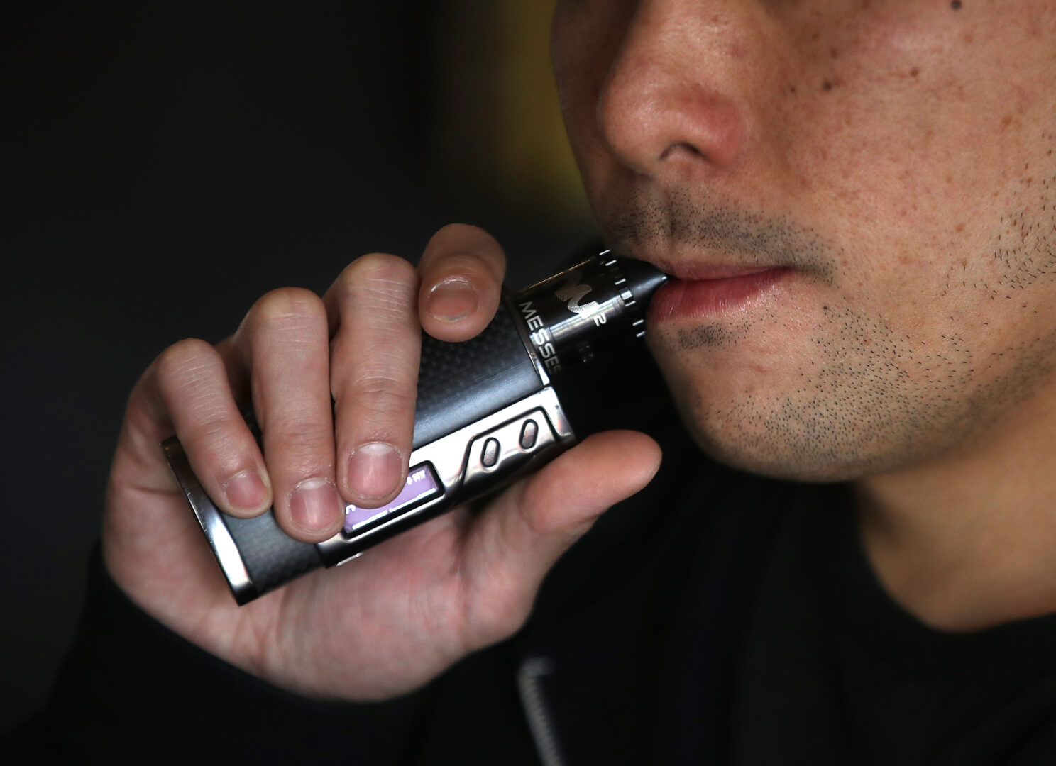 Jeremy Wong smokes an e-cigarette at The Vaping Buddha in San Francisco.