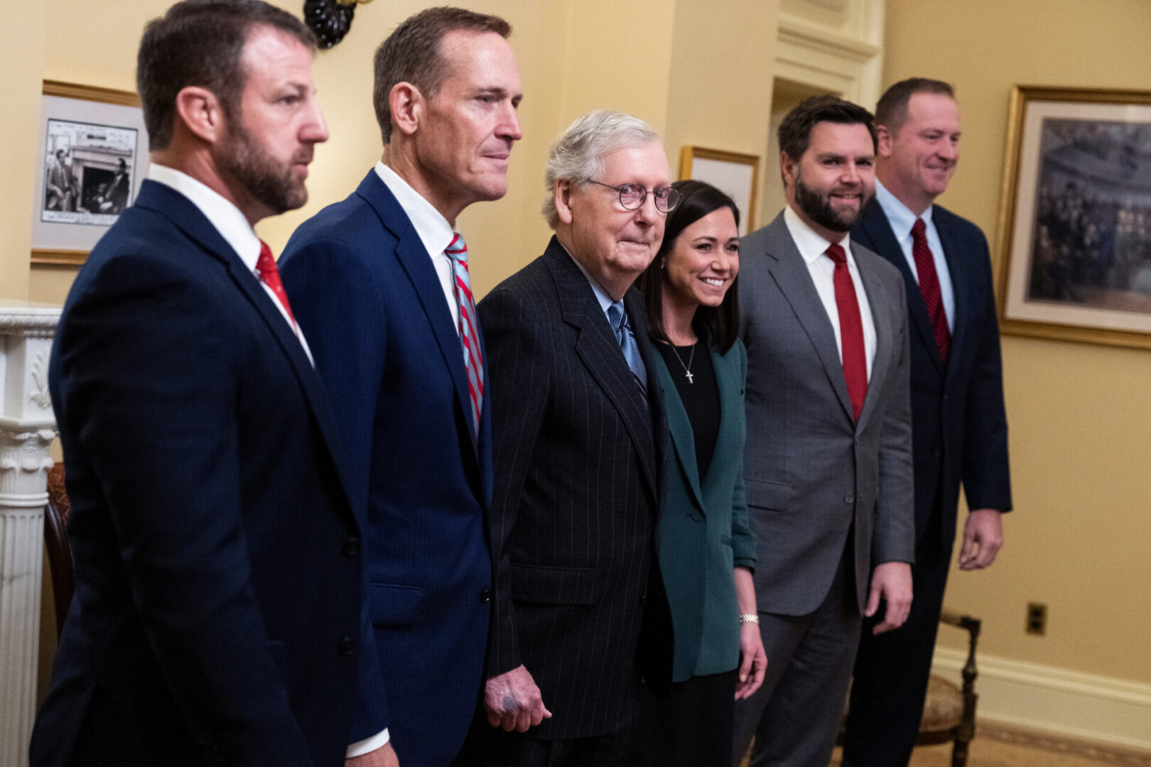 With one race in Georgia headed to a runoff, the five new GOP senators in the next Congress all filled seats previously held by Republicans. From left, Sens.-elect Markwayne Mullin of Oklahoma and Ted Budd of North Carolina, Senate Minority Leader Mitch McConnell and Sens.-elect Katie Britt of Alabama, J.D. Vance of Ohio and Eric Schmitt of Missouri pose for photos before a meeting in the Capitol on Tuesday.