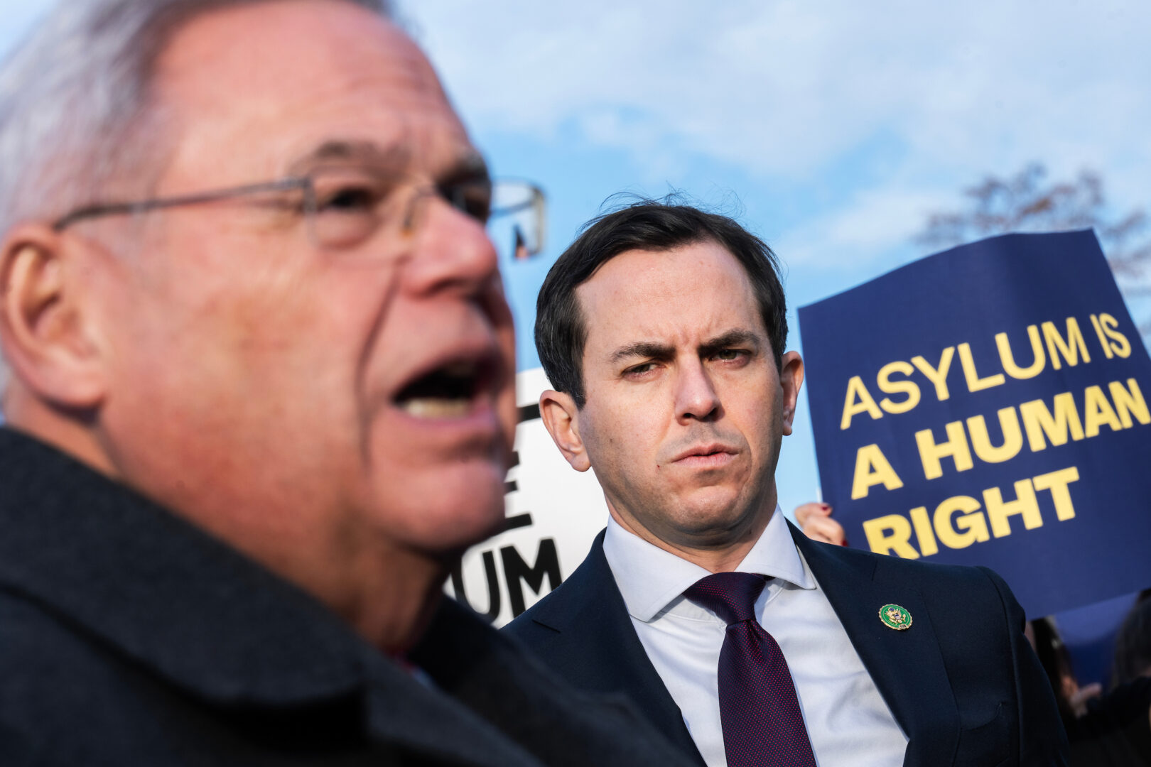 Rep. Rob Menendez, D-N.J., right, joins his father, Sen. Bob Menendez, also D-N.J., at a news conference with the Congressional Hispanic Caucus on Dec. 13, 2023.