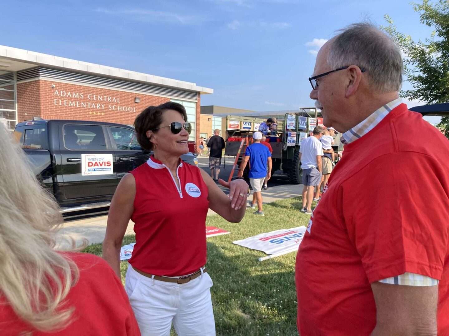 Candidate Wendy Davis talks with a supporter before the Adams County fair parade on July 18 in Monroe, Ind.