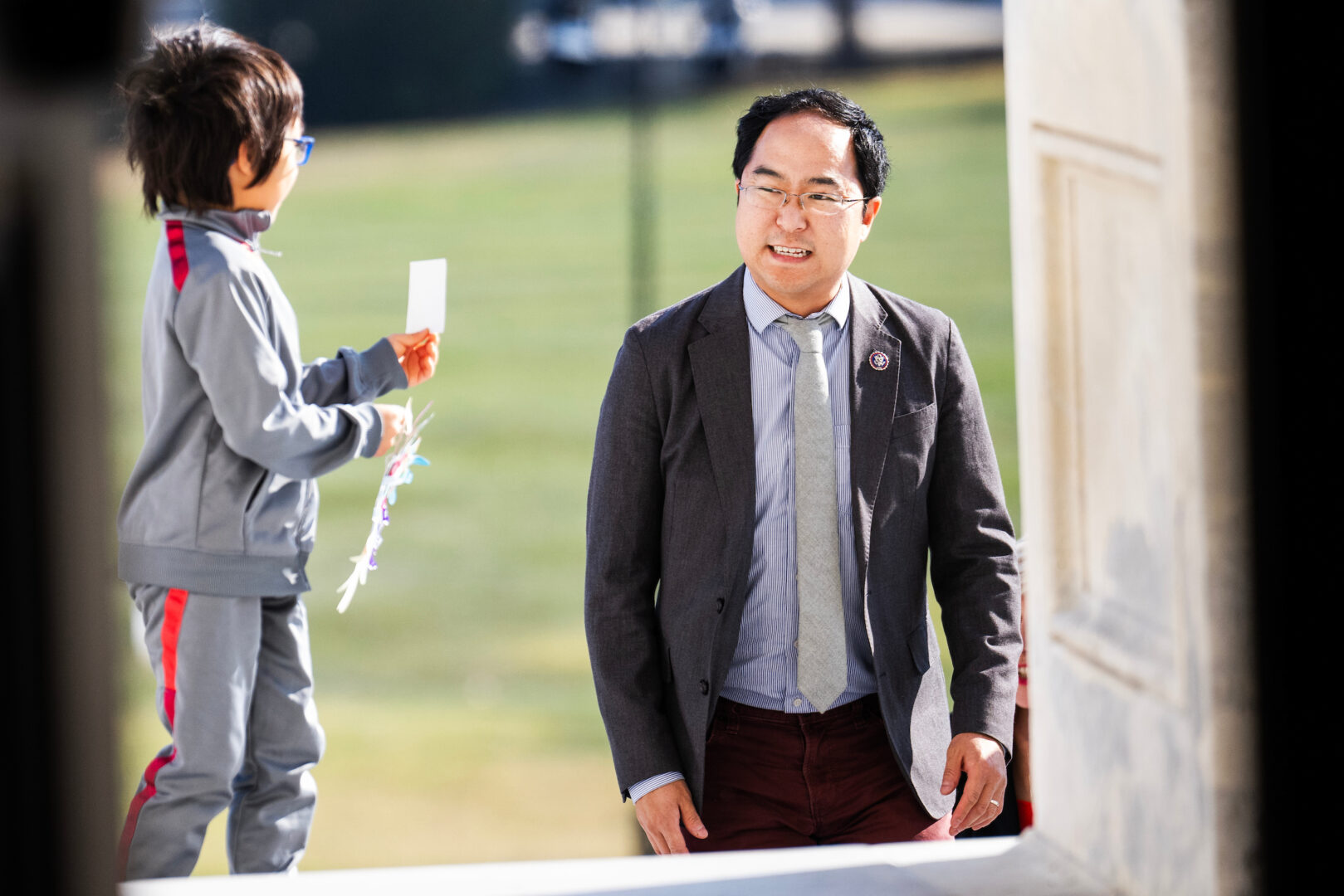 New Jersey Democratic Rep. Andy Kim and his son arrive at the Capitol before votes on Nov. 9, 2023.