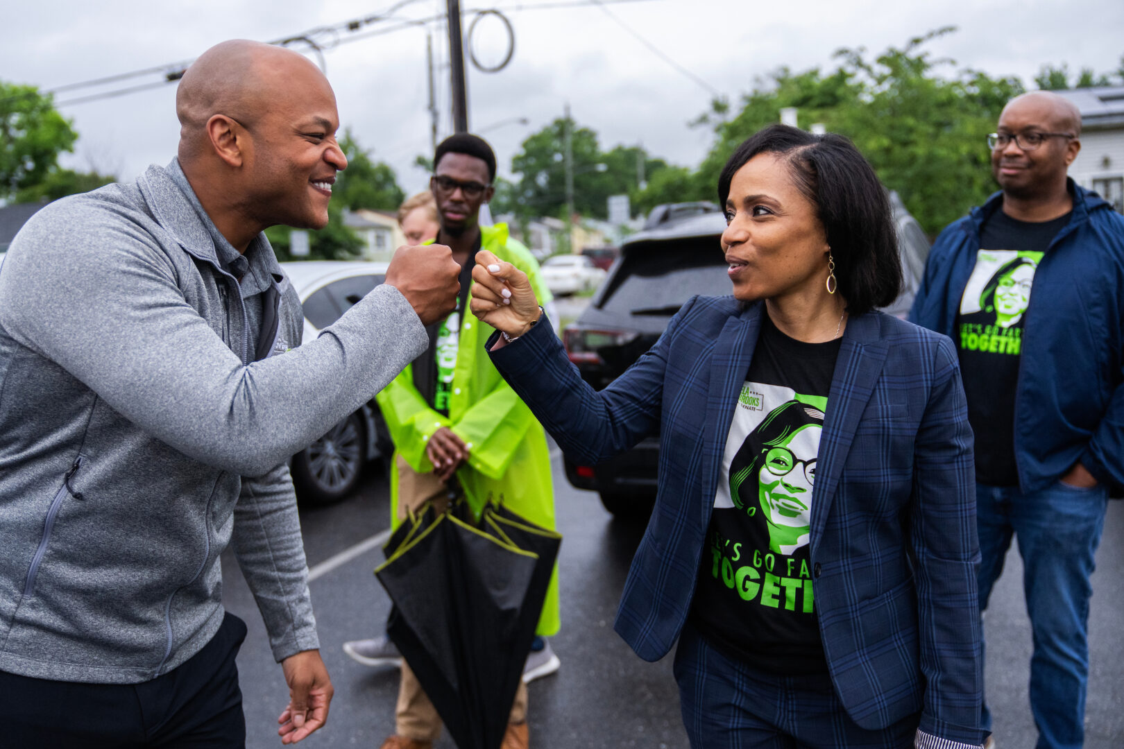 Maryland Democratic Senate candidate Angela Alsobrooks bumps fists with Gov. Wes Moore while greeting voters at Lewisdale Elementary School in Chillum, Md., on Tuesday.