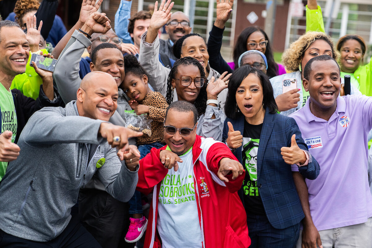 Angela Alsobrooks, second from right, Democratic Senate candidate from Maryland, and Gov. Wes Moore, D-Md., left, pose for picture with voters on the state’s primary election day at Lewisdale Elementary School in Chillum, Md., on Tuesday.