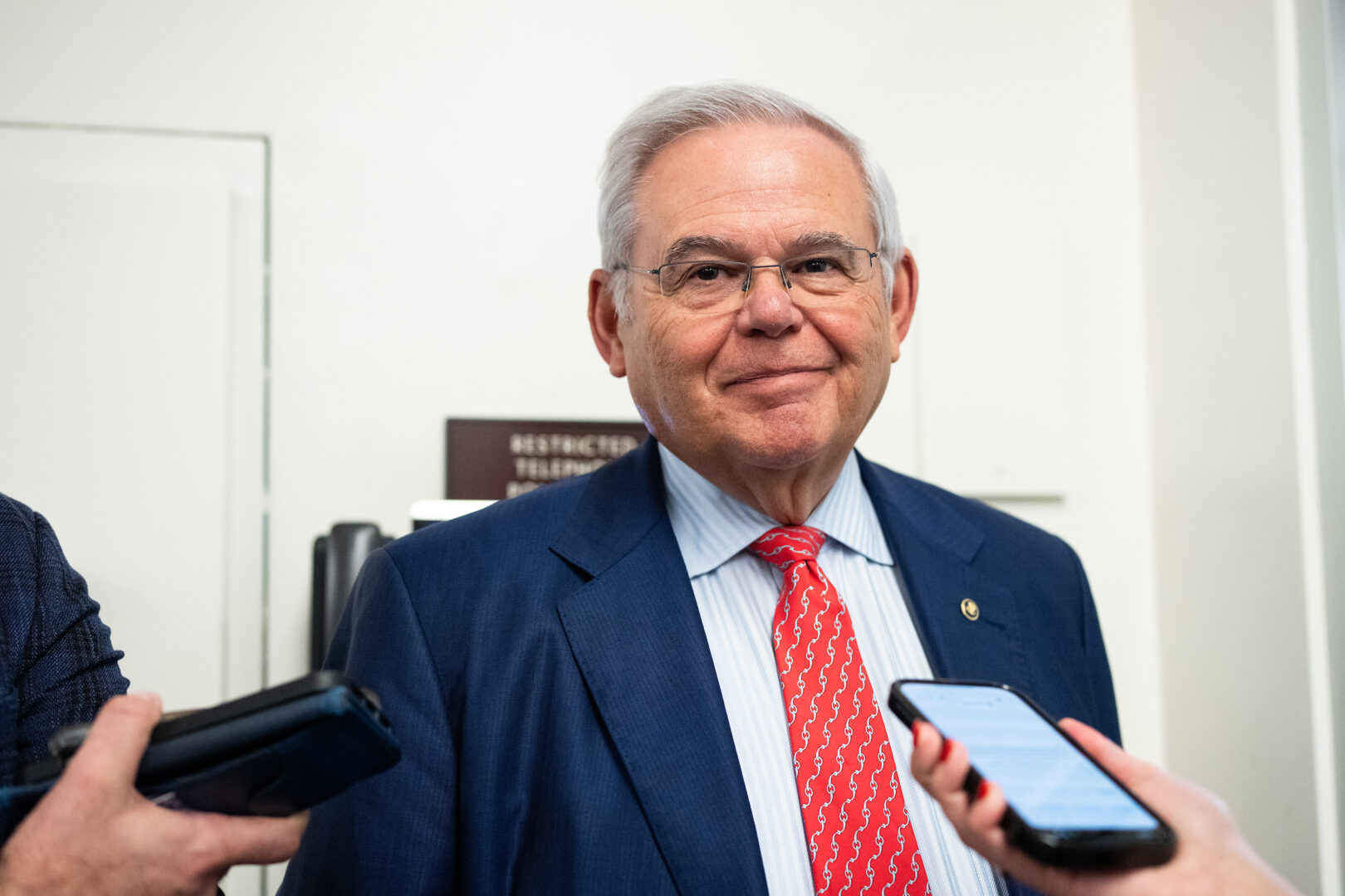 Sen. Bob Menendez, D-N.J., speaks to reporters in the Senate subway after a vote in January. 