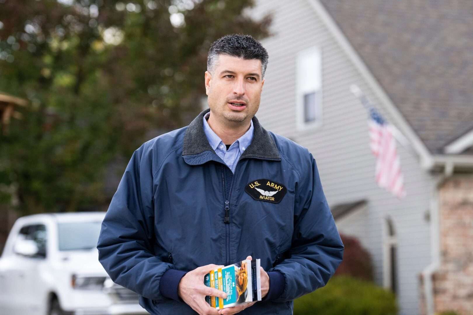 Republican state Sen. Tom Barrett, seen going door-to-door to meet voters in Michigan in 2022, is running again in Michigan's 7th District. 