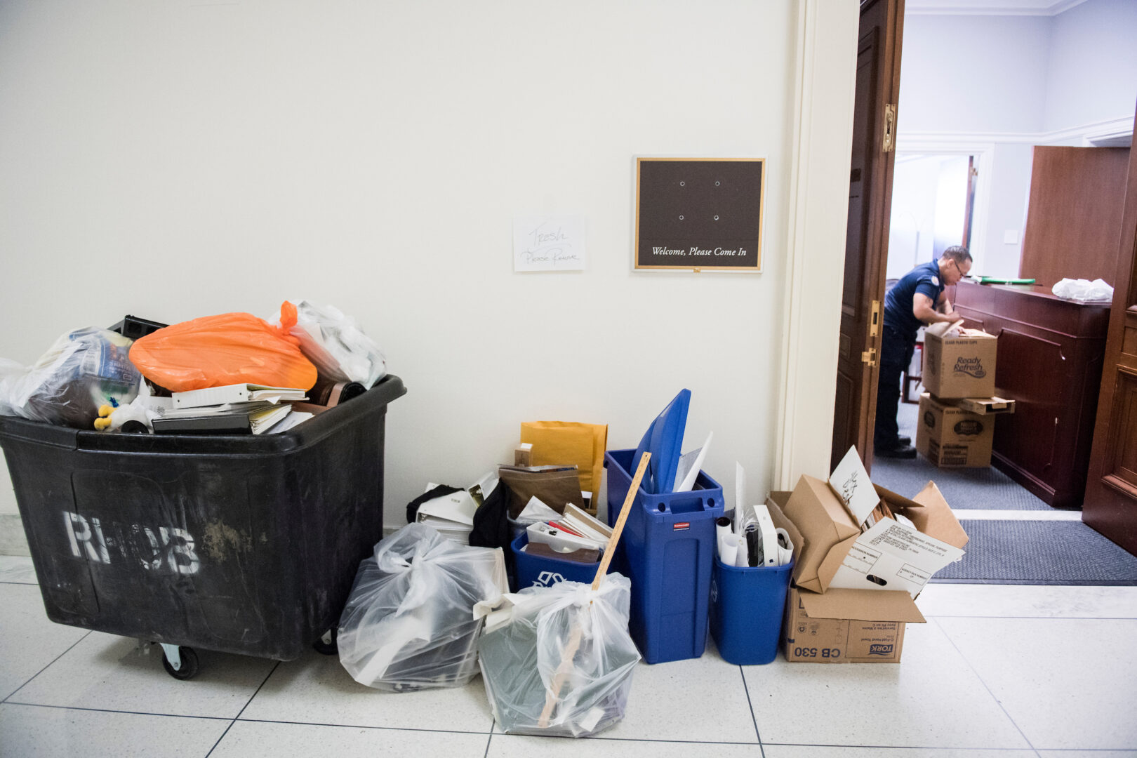 Trash and boxes are seen stacked outside a House office in 2018. When departing members leave office, transitions can be rocky for their replacements (and constituents).