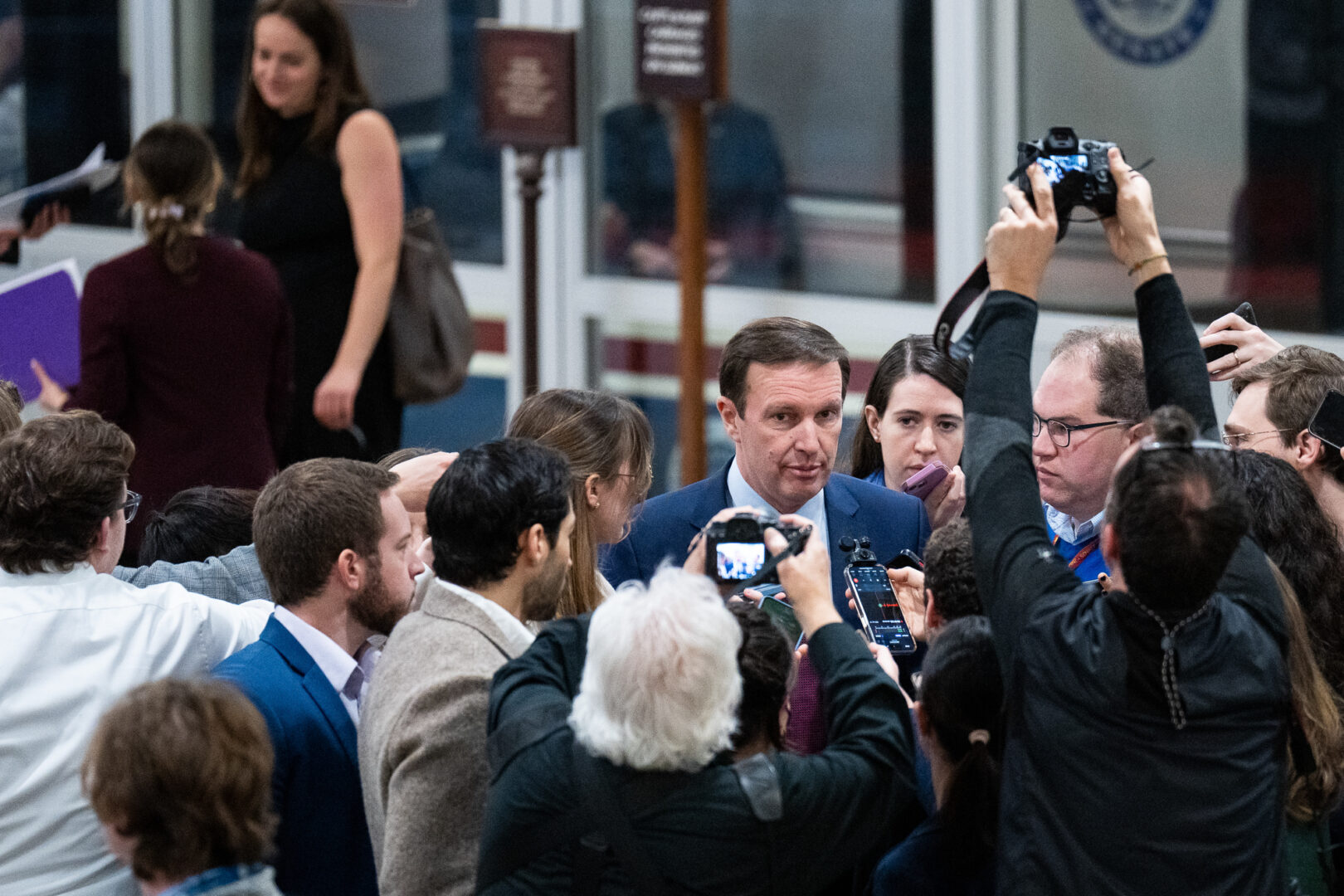 Sen. Christopher S. Murphy, D-Conn.,  shown speaking  to reporters in the Senate subway Jan. 25, said Republicans have yet to decide whether they want to both continue funding Ukraine and address border security.