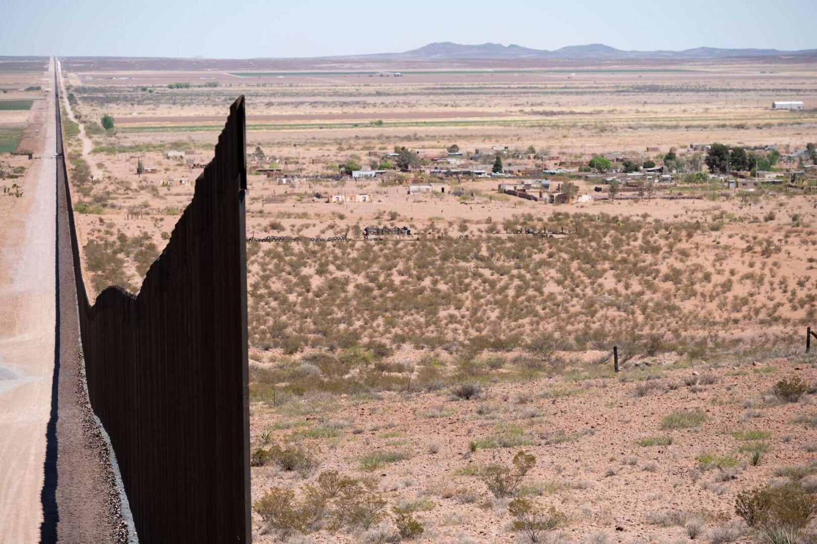 The border wall stretches along the U.S.-Mexico border on the Johnson Ranch near Columbus, N.M., on April 12, 2021.