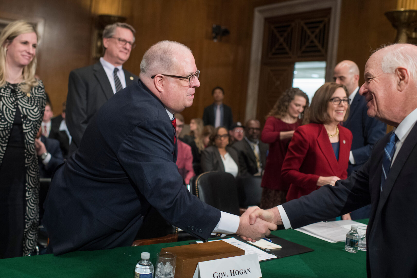 Former Maryland Gov. Larry Hogan, left, a Republican who launched a bid for Senate last week, shakes hands with the Democrat he is running to succeed, Sen. Benjamin L. Cardin, at a 2018 Senate committee hearing.