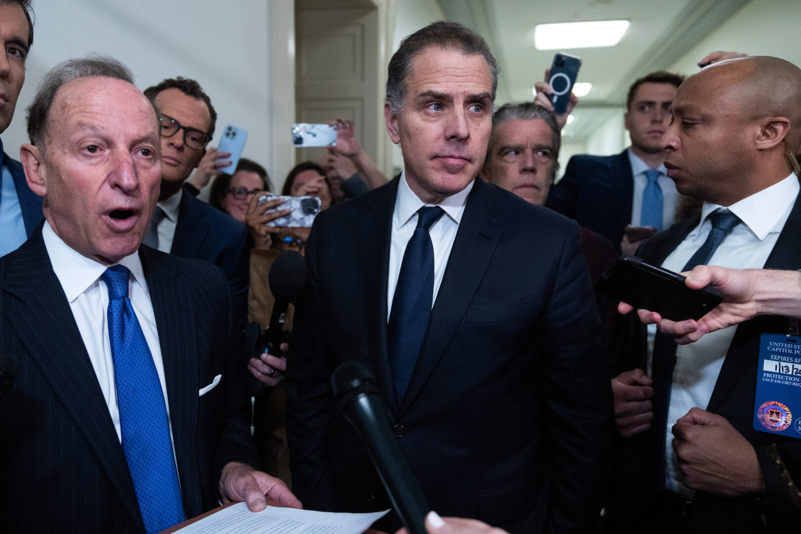 Hunter Biden, center, and his attorney Abbe Lowell, left, address the media after leaving a House Oversight and Accountability Committee markup in January. 