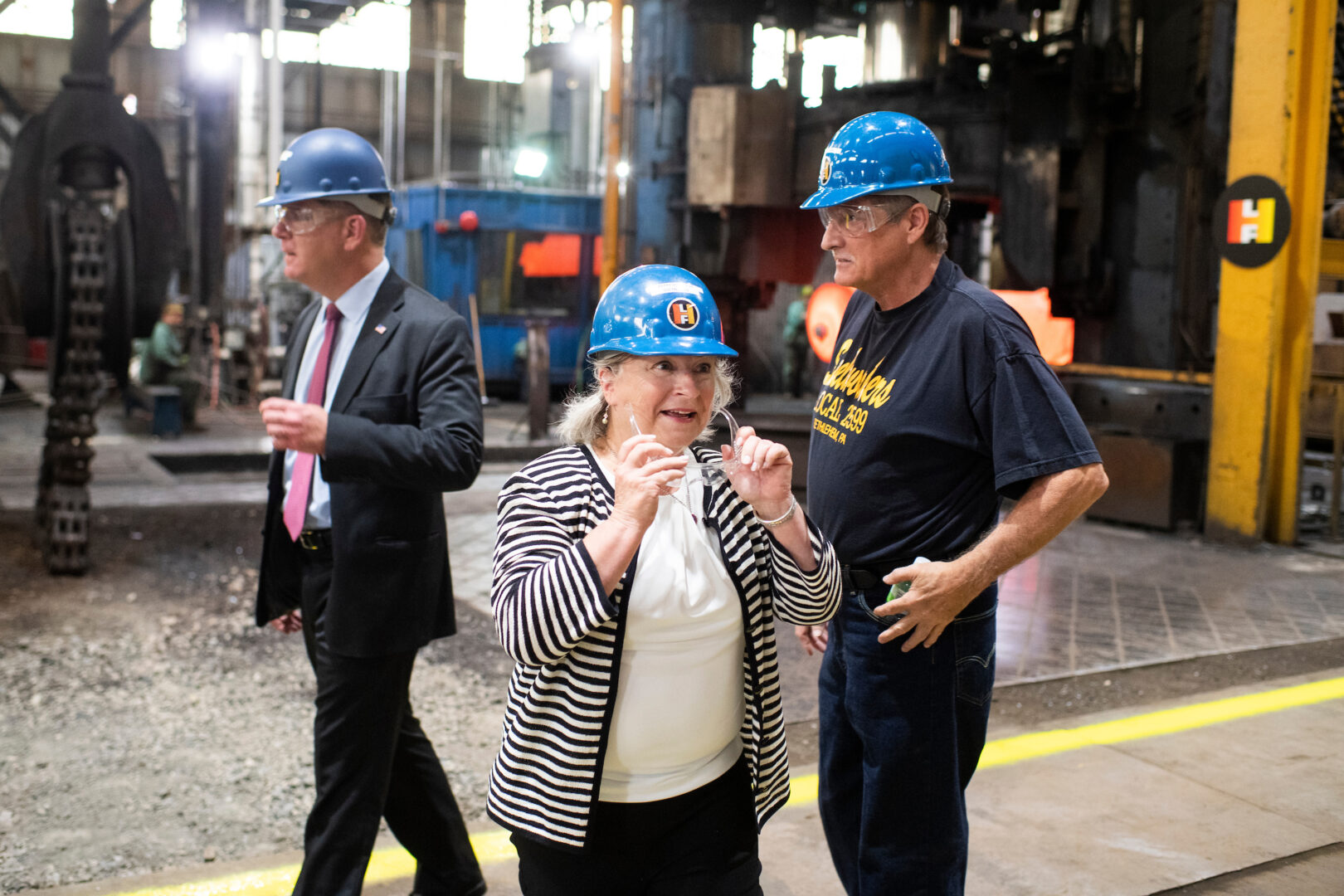 Pennsylvania Democratic Rep. Susan Wild and Labor Secretary Marty Walsh, left, tour Lehigh Heavy Forge in Bethlehem, Pa., to promote legislation to create jobs on June 2, 2021.