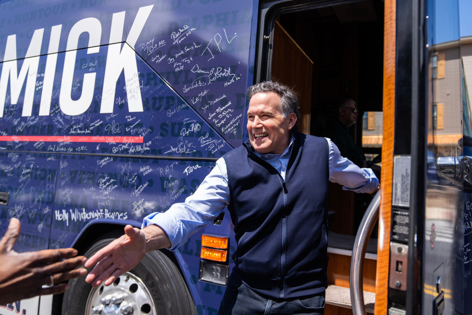 Dave McCormick, the Republican U.S. Senate candidate from Pennsylvania, reaches out to shake hands with a voter after a campaign rally at Beerded Goat Brewery in Harrisburg, Pa., on April 25. 