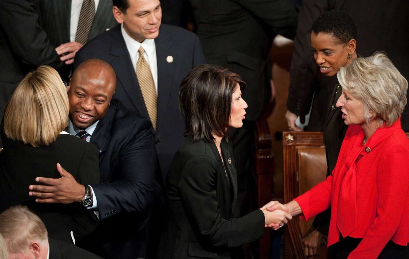 At the start of the 112th Congress on Jan. 5, 2011, Rep. Tim Scott, R-S.C., left, hugs Rep. Ileana Ros-Lehtinen, R-Fla., as Rep. Kristi Noem, R-S.D., shakes hands with Rep. Jane Harman, D-Calif. 