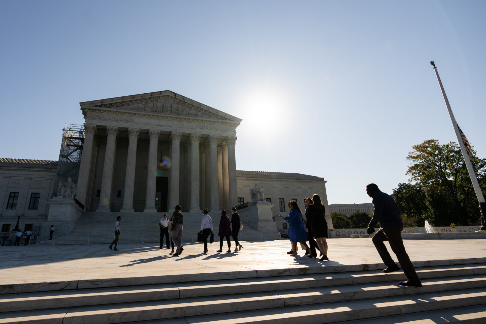 Visitors walk across the Supreme Court plaza to enter the building for the first day of the court’s session in October 2023.