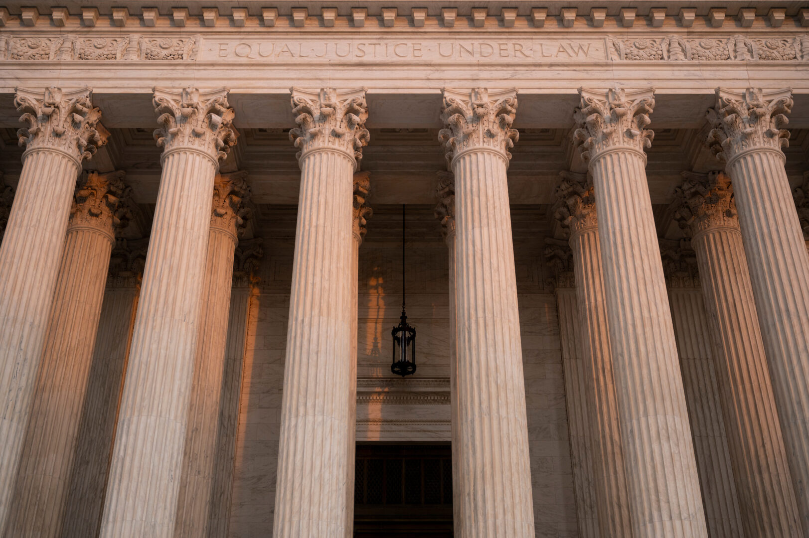 The Supreme Court building is seen at sunset. 