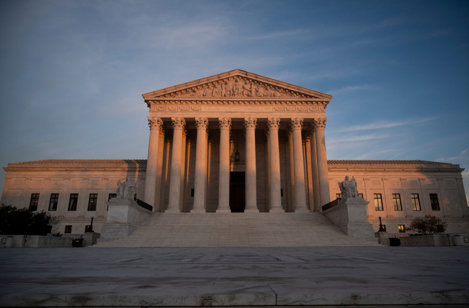 The Supreme Court building is seen at sunset. 