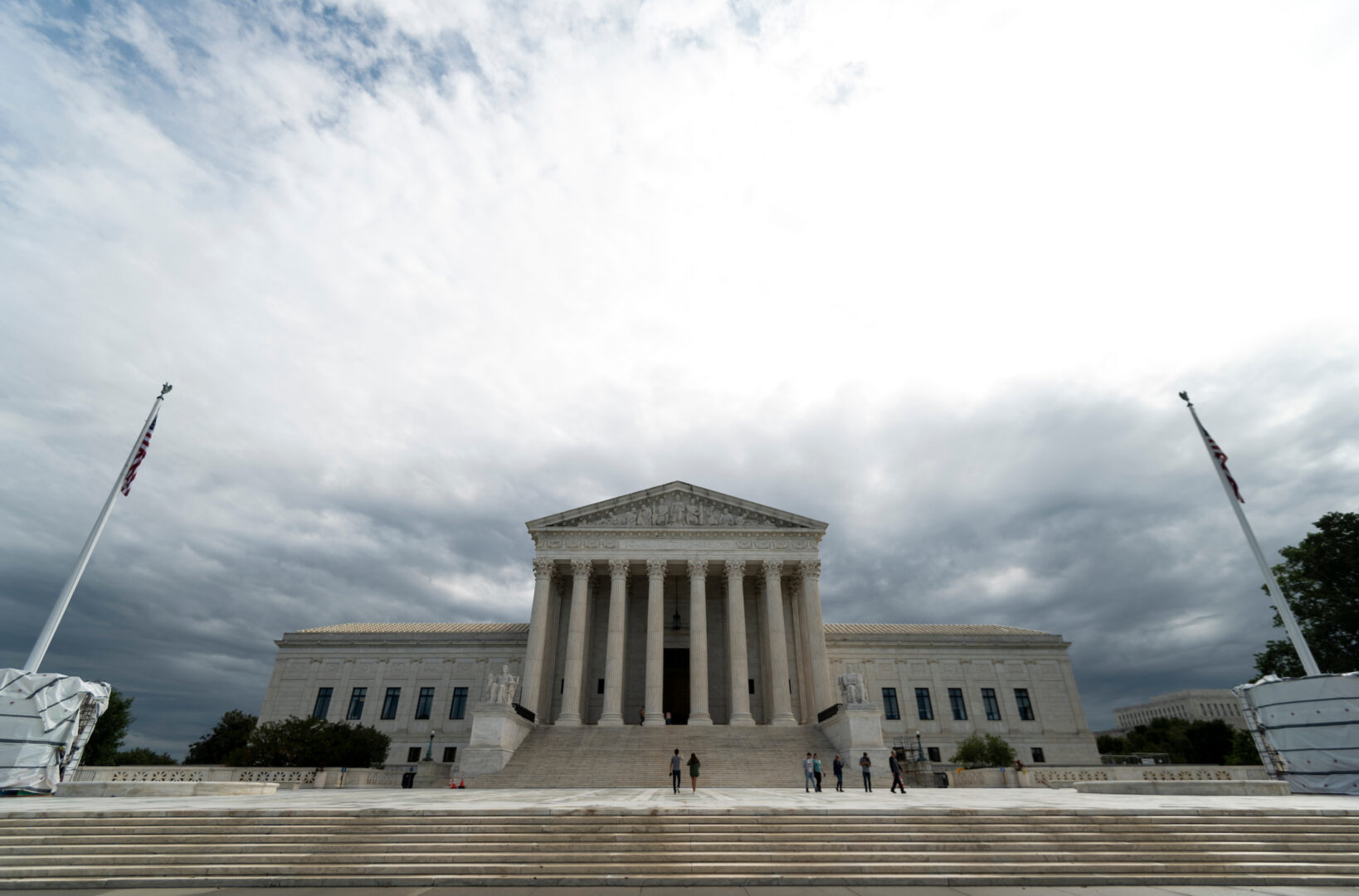 Storm clouds hang over the Supreme Court building. 