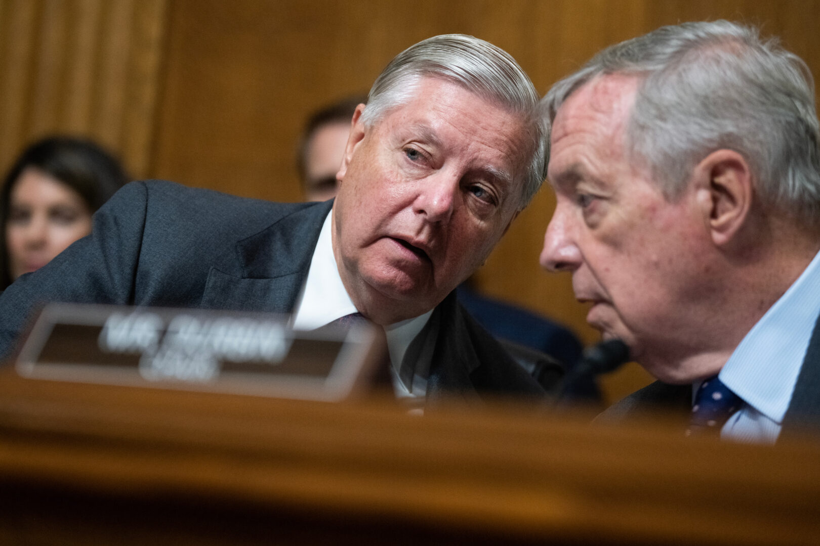 Chair Richard J. Durbin, D-Ill., right, and ranking member Sen. Lindsey Graham, R-S.C., talk during a Senate Judiciary Committee hearing in September. 