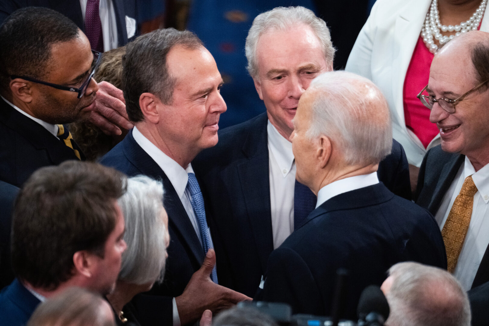 Rep. Adam B. Schiff, D-Calif., left, talks with President Joe Biden after the State of the Union address in the House chamber on March 7. 