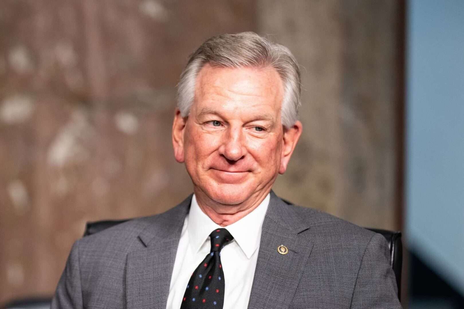 Sen. Tommy Tuberville, R-Ala., takes his seat Tuesday before a confirmation hearing for the nominee for chairman of the Joint Chiefs of Staff, Gen. Charles Brown Jr., in the Senate Armed Services Committee. 