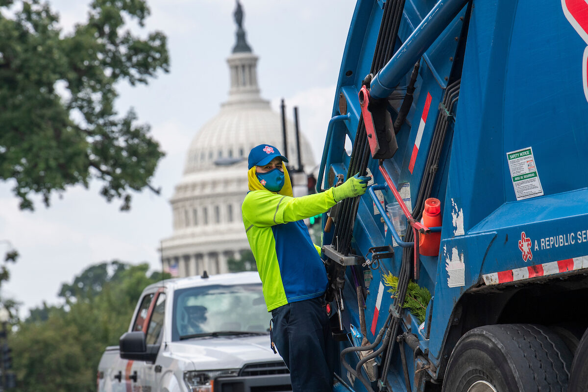 A sanitation worker is seen on Maryland Avenue, NE, near the Capitol on Aug. 2, 2021. 